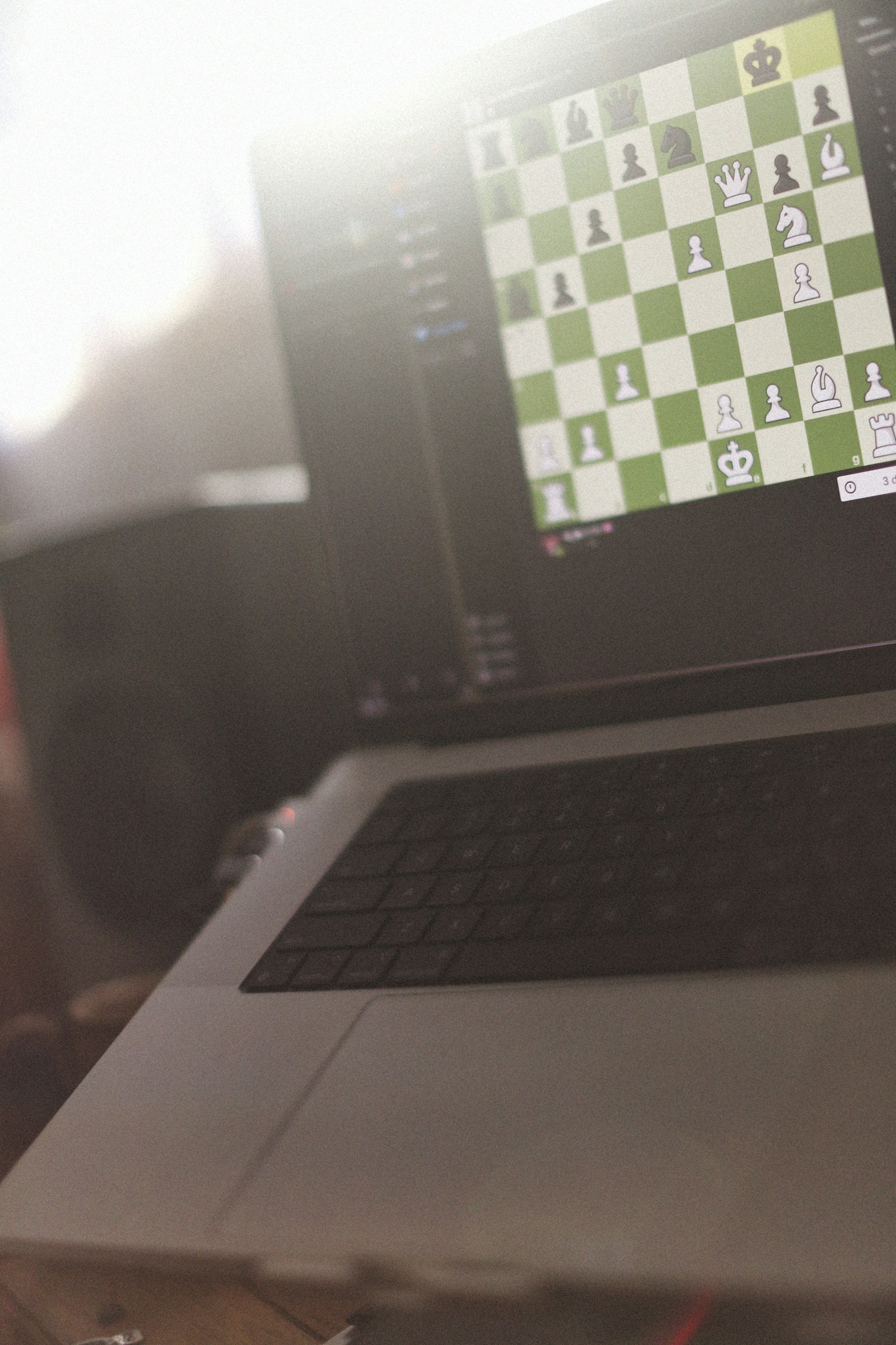 A digital chess game on a laptop