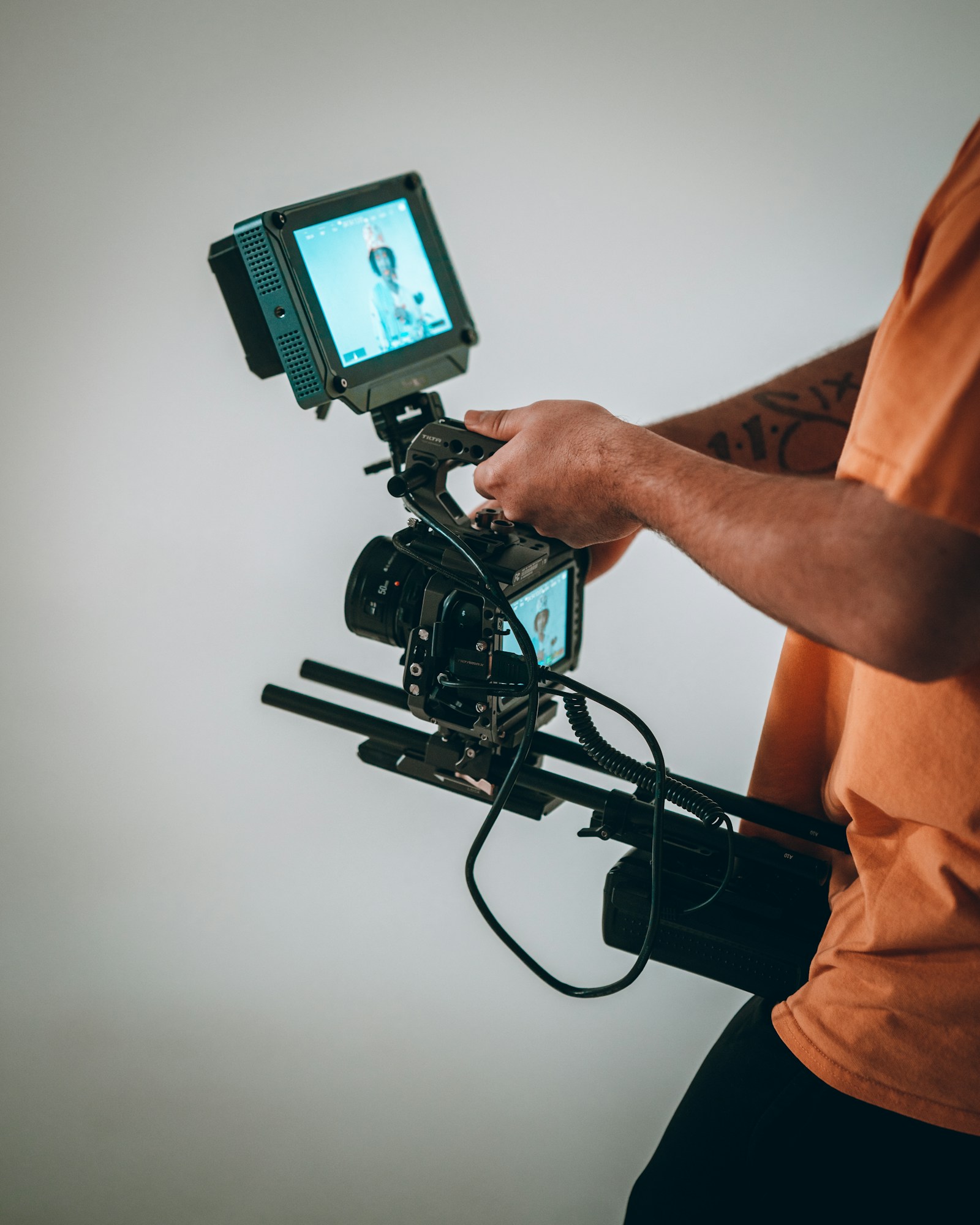 A filmmaker operating a video camera